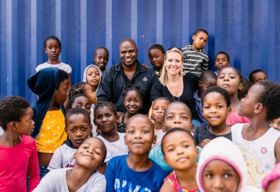 Lady with a group of African children